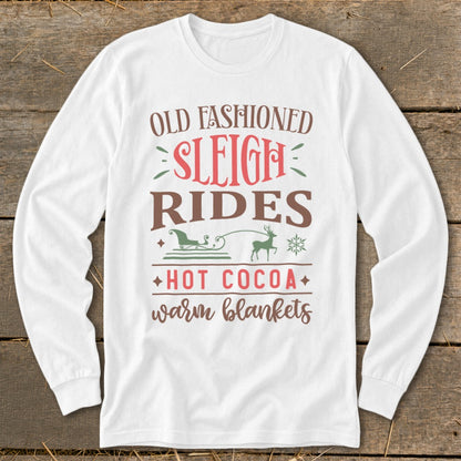 White long-sleeve shirt with "Old Fashioned Sleigh Rides Hot Cocoa Warm Blankets" text and graphics.