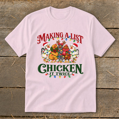 Pink t-shirt with five chickens wearing Santa hats and decorated with Christmas lights.