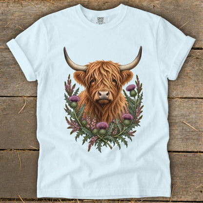White t-shirt with highland cow and thistles graphic, "COMFORT COLORS" logo.