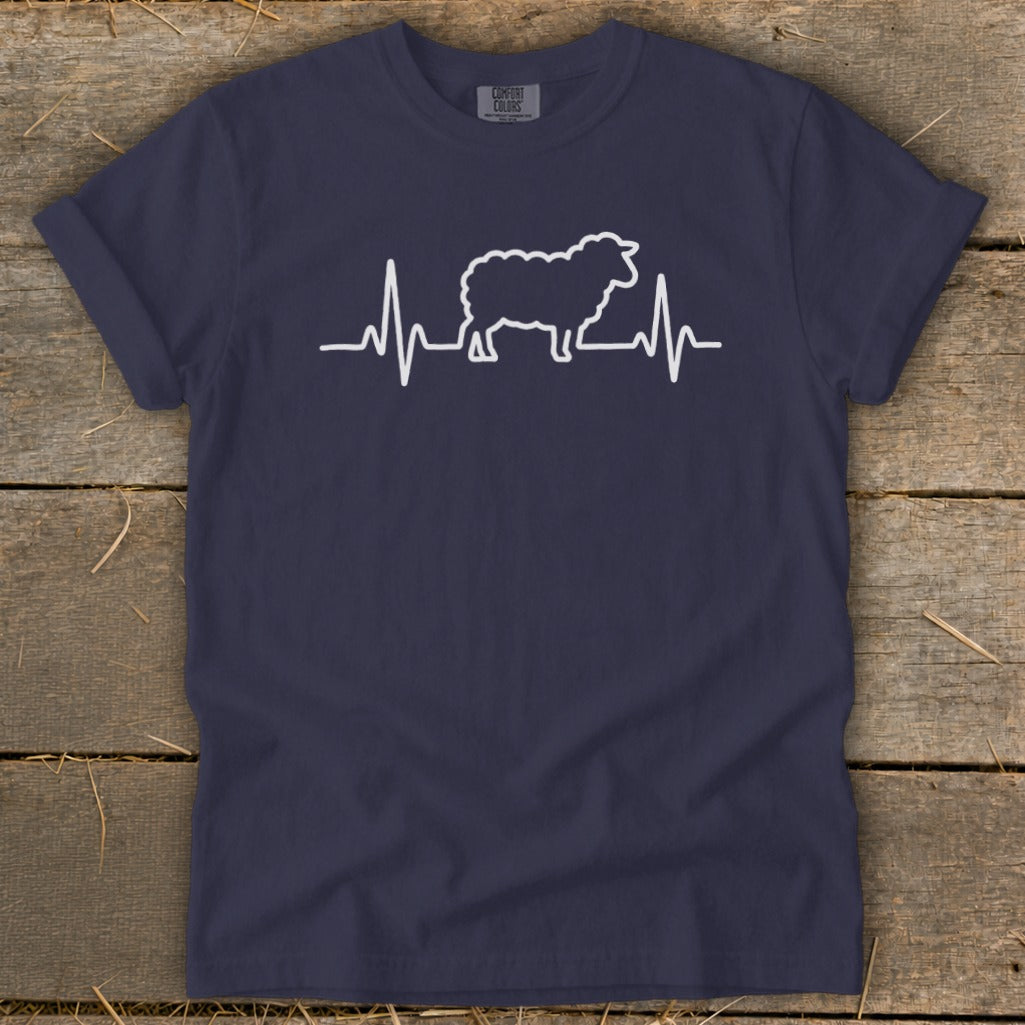 Dark blue t-shirt featuring a white graphic of a sheep integrated into a heartbeat line.
