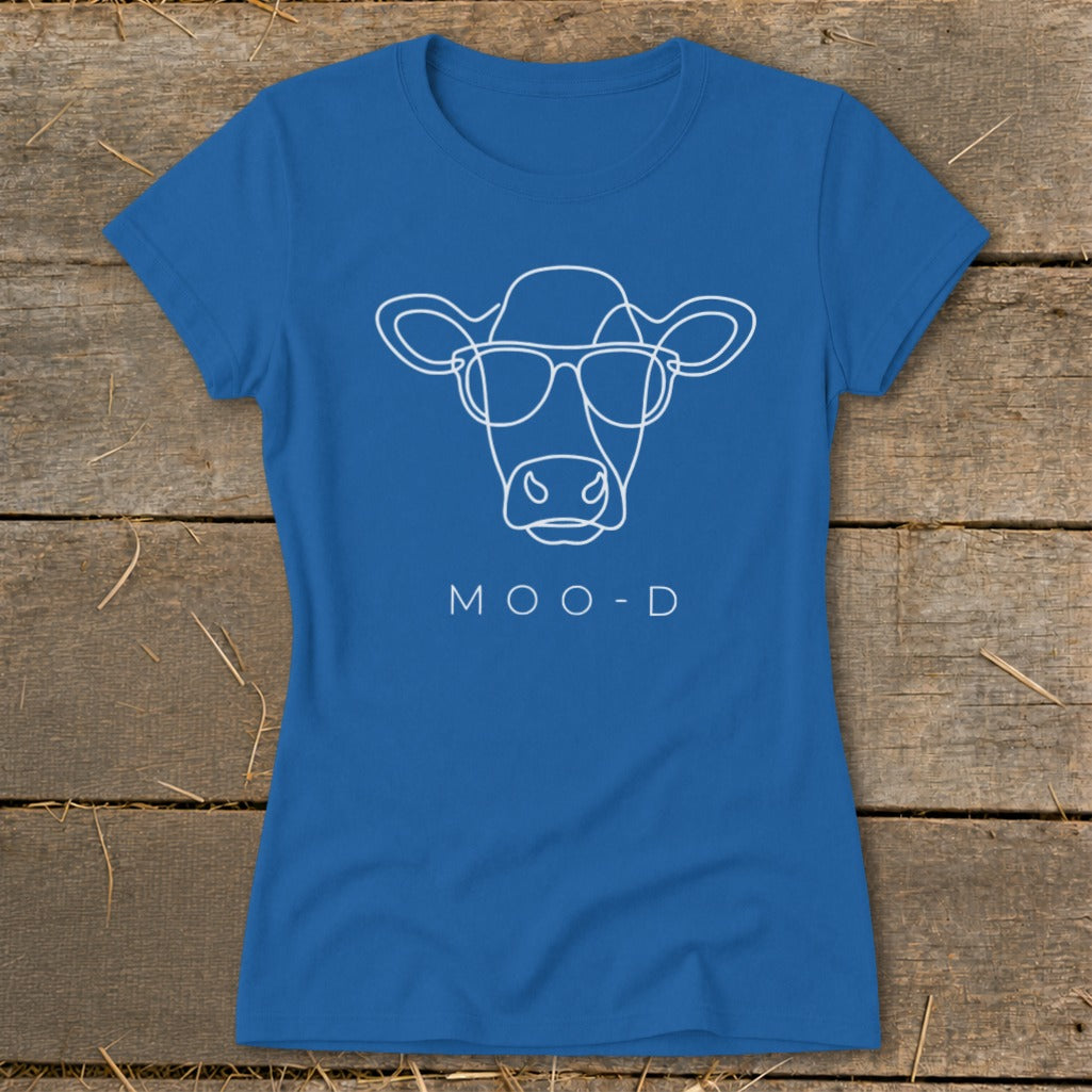 Blue t-shirt with white outline of a cow wearing sunglasses and text "MOO-D".