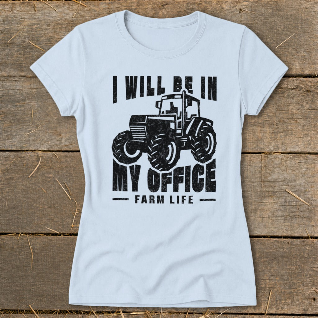 Light blue t-shirt with black graphic of a tractor and text "I will be in my office. Farm Life."