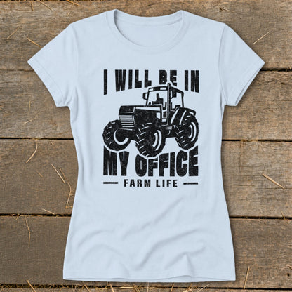 Light blue t-shirt with black graphic of a tractor and text "I will be in my office. Farm Life."