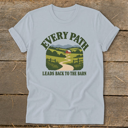 Light blue t-shirt with green text and farm landscape graphic: "EVERY PATH LEADS BACK TO THE BARN".