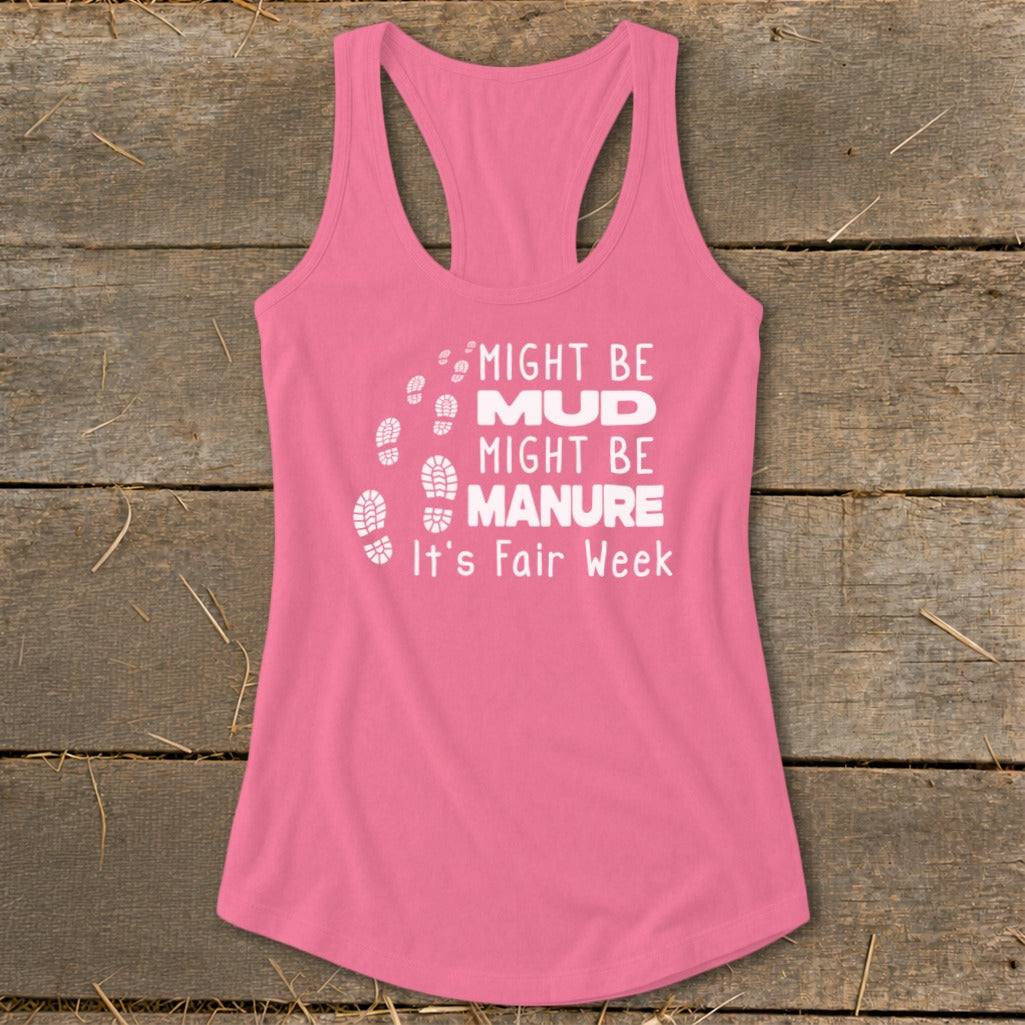 Pink tank top with white text "Might Be Mud, Might Be Manure, It's Fair Week."