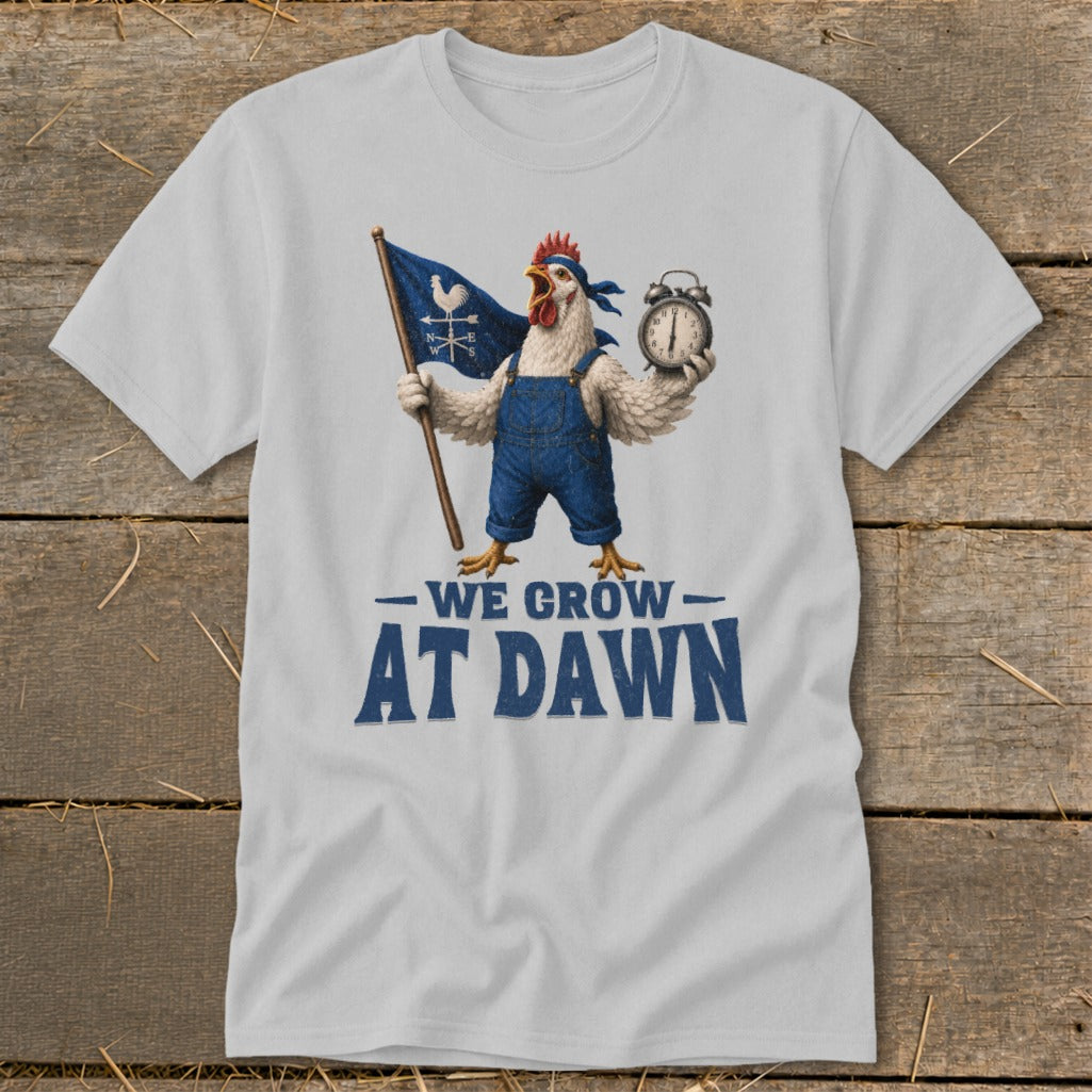 Chicken in overalls holds flag and alarm clock with text "We Grow At Dawn".