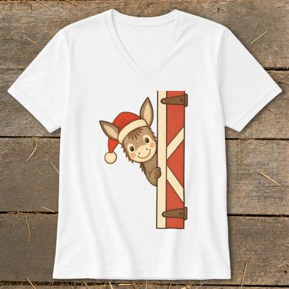 White t-shirt with a cartoon donkey wearing a Santa hat peeking from behind a barn door.