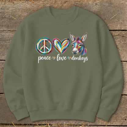 Peace love donkeys graphic on a green sweatshirt
