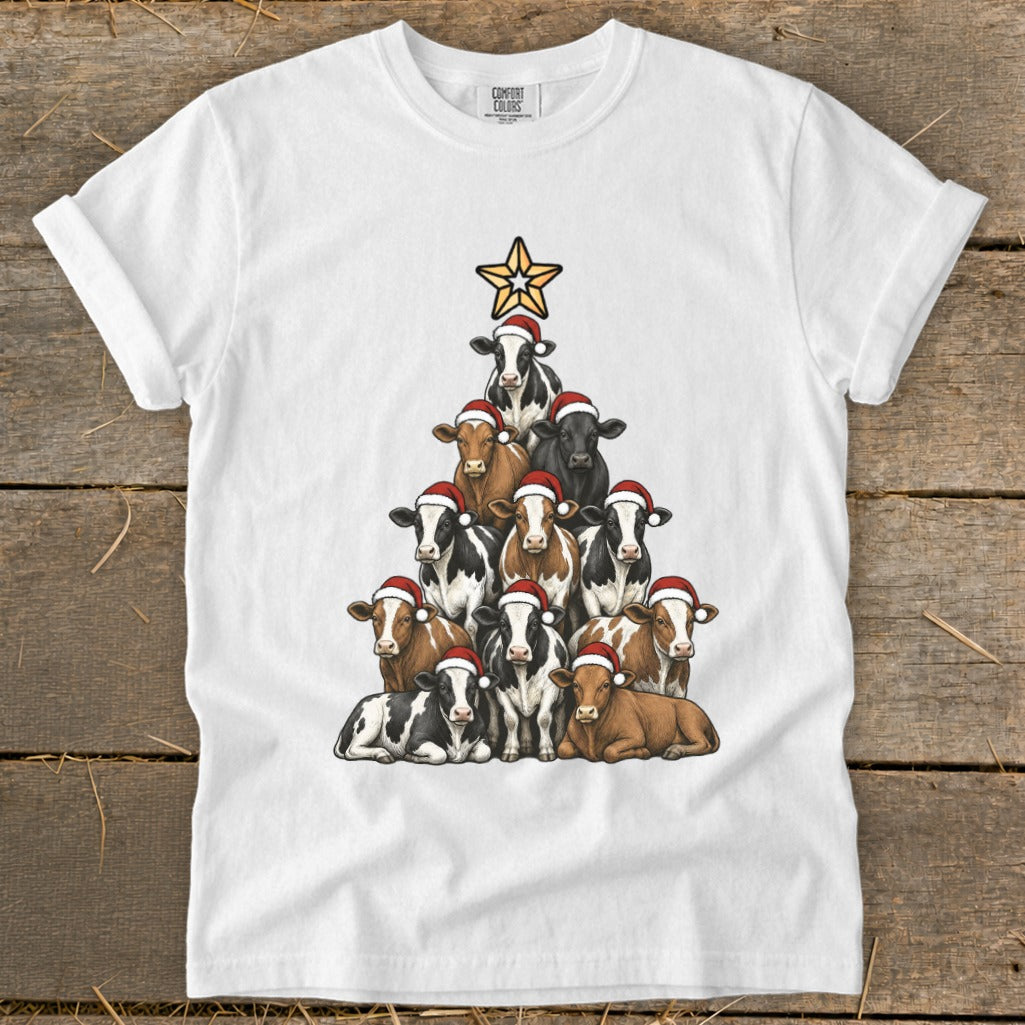 White t-shirt featuring a Christmas tree made of cows wearing Santa hats and a star.