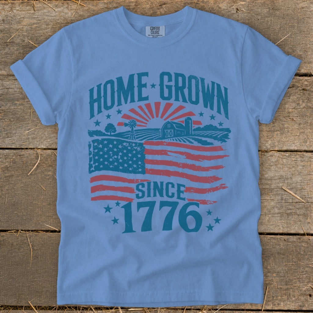 Light blue t-shirt with "HOME GROWN SINCE 1776" and American flag farm distressed graphic.