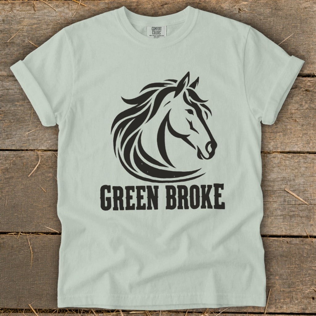 Light green t-shirt with a black horse head graphic and the text GREEN BROKE.