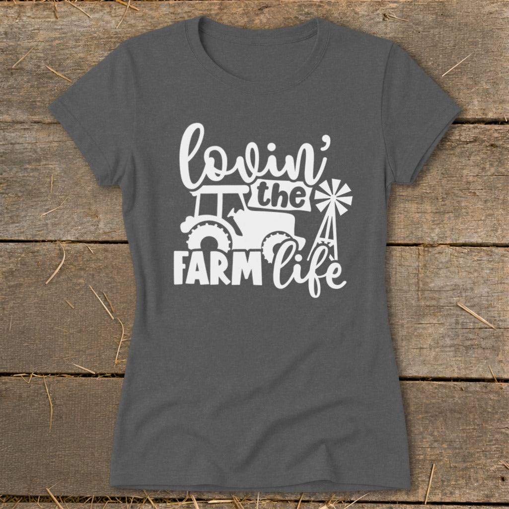 Dark gray t-shirt with white text and graphics: "lovin' the FARM life" with tractor and windmill.