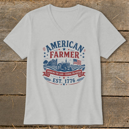 T-shirt graphic with "American Farmer" text, tractor, barn, and US flag.