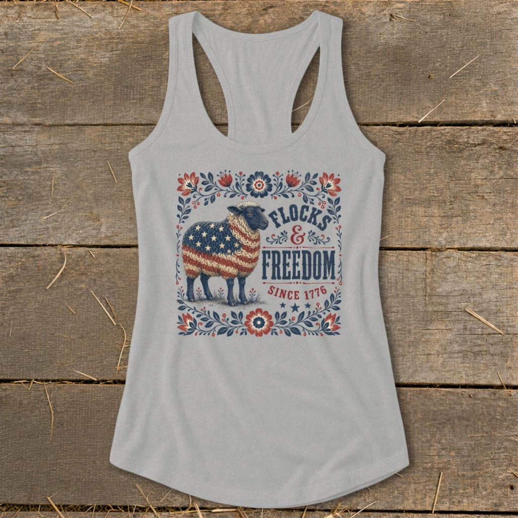 Gray tank top with a sheep design featuring the American flag and "Flocks & Freedom Since 1776".