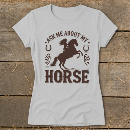 Light gray t-shirt with brown graphic featuring a woman riding a horse and text "Ask Me About My Horse".