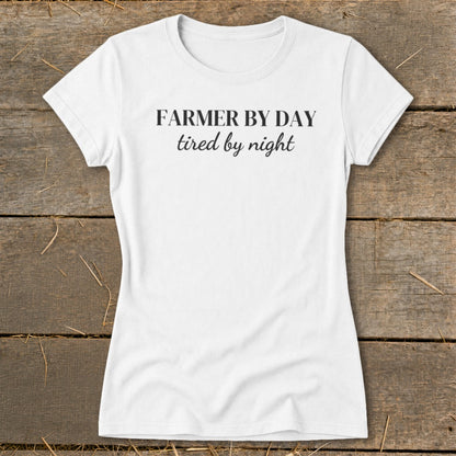 White t-shirt with black text reading "FARMER BY DAY tired by night".