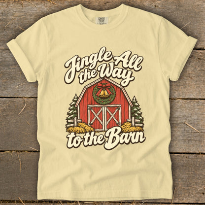 Light yellow t-shirt with red barn graphic and "Jingle All the Way to the Barn" text.