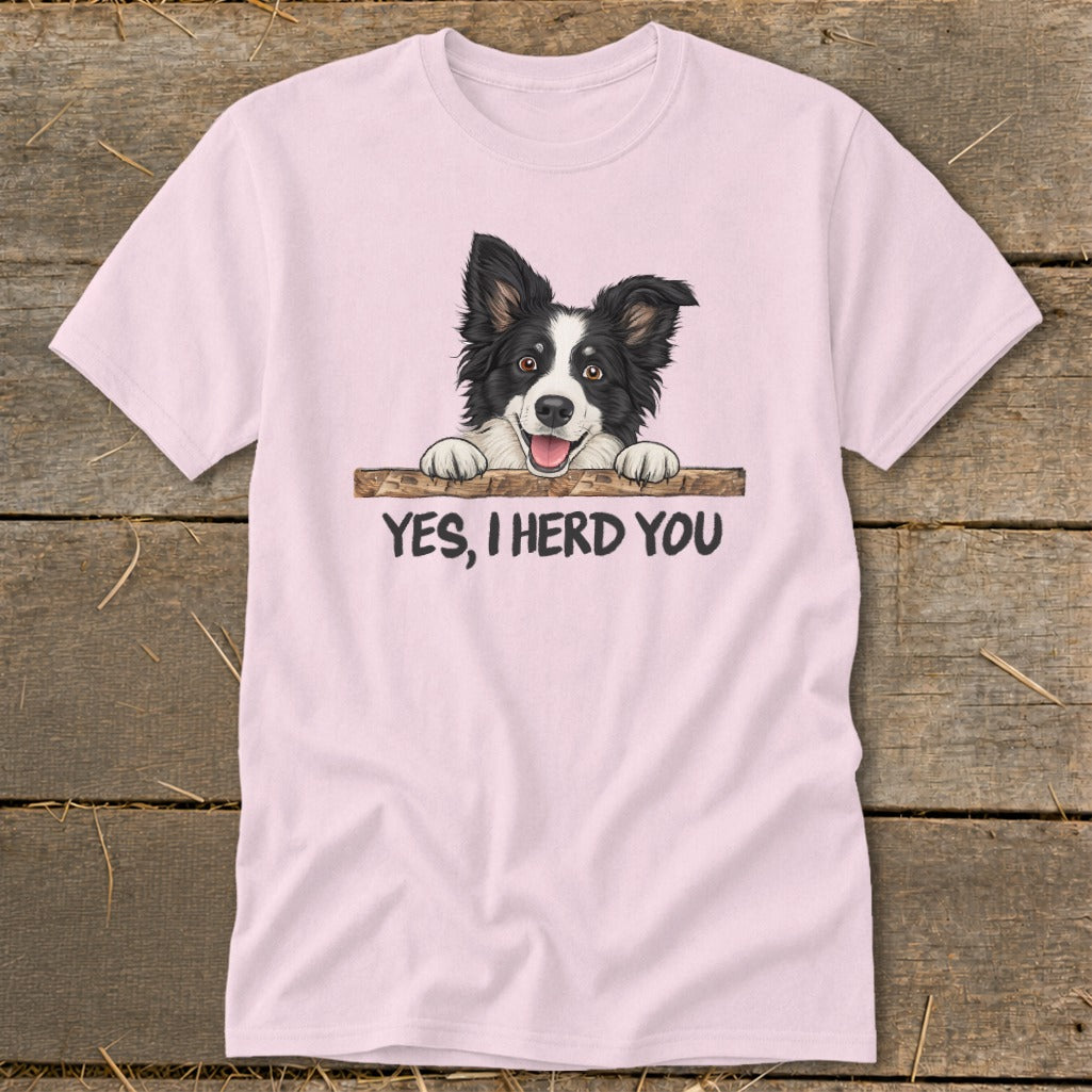 Pink t-shirt with a Border Collie peeking over a wooden plank with the text "YES, I HERD YOU".