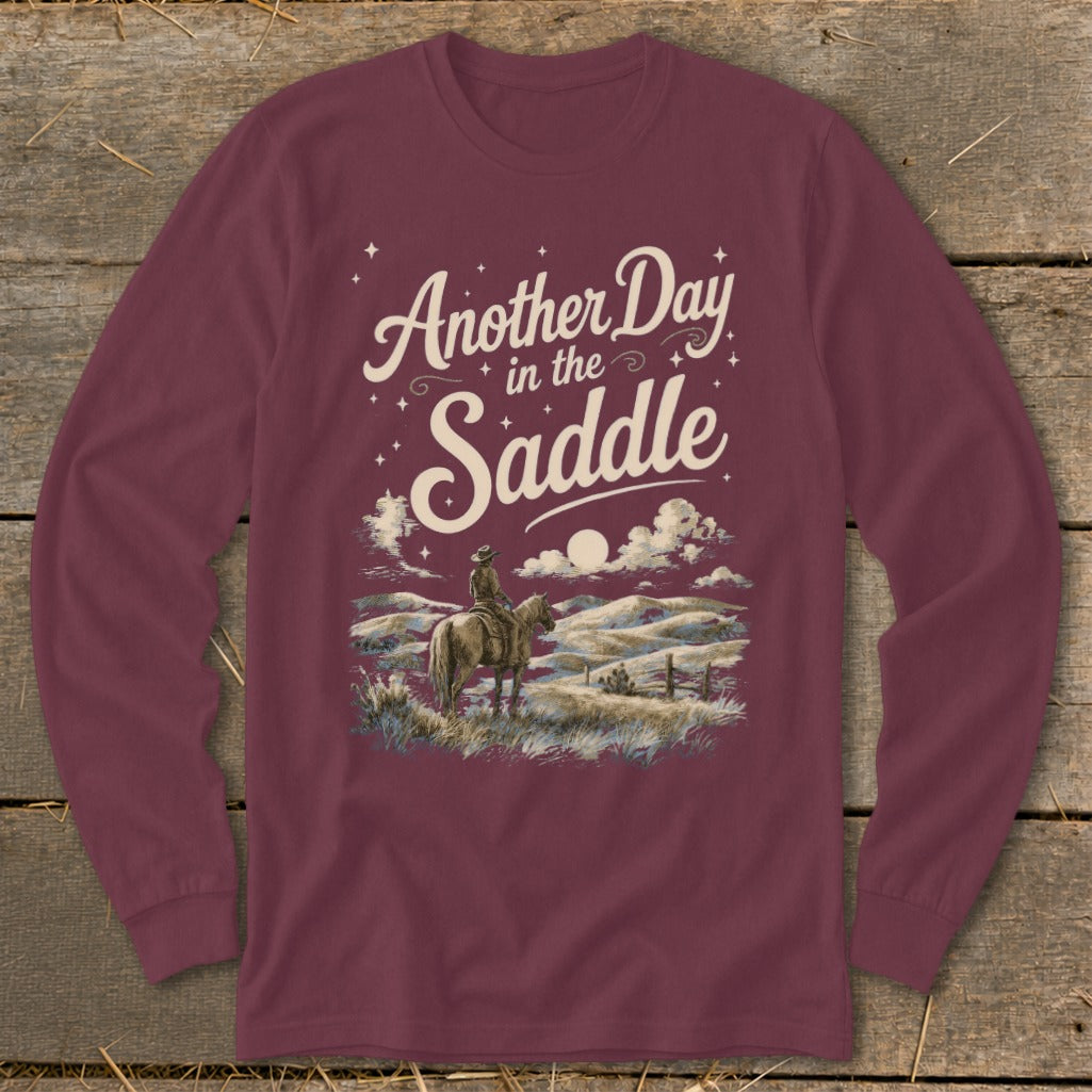 Maroon long-sleeve shirt with "Another Day in the Saddle" graphic.