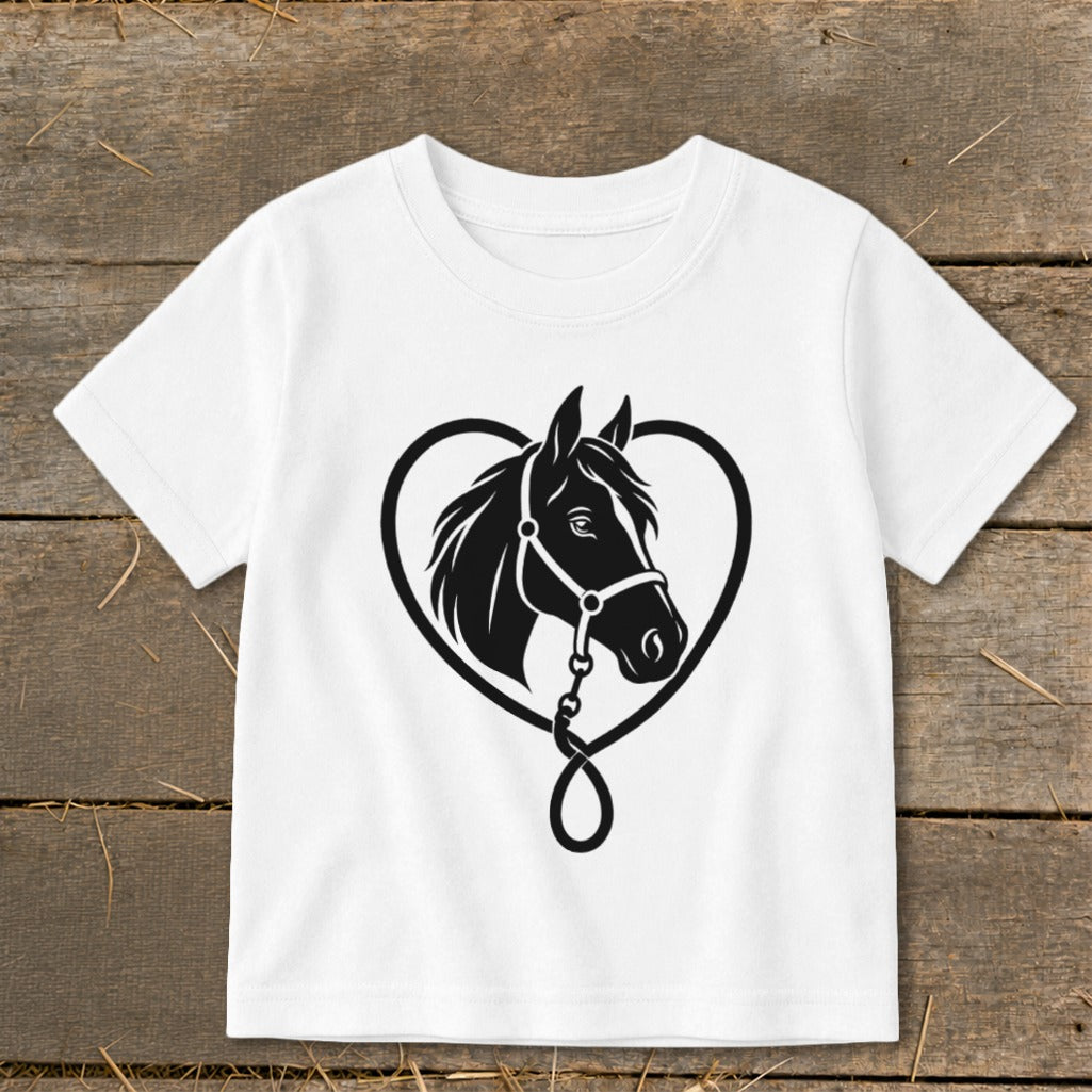 A white child's t-shirt features a black graphic of a horse head inside a heart outline.