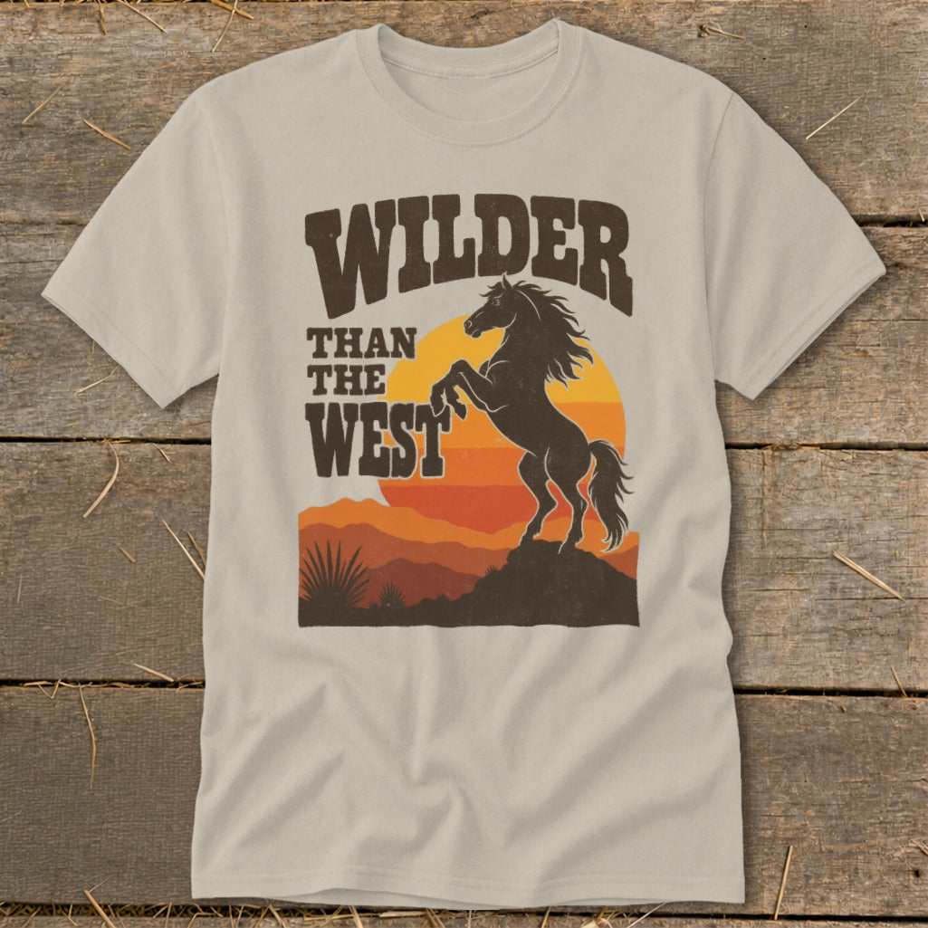 T-shirt with "Wilder Than The West" text and a rearing horse silhouette at sunset.