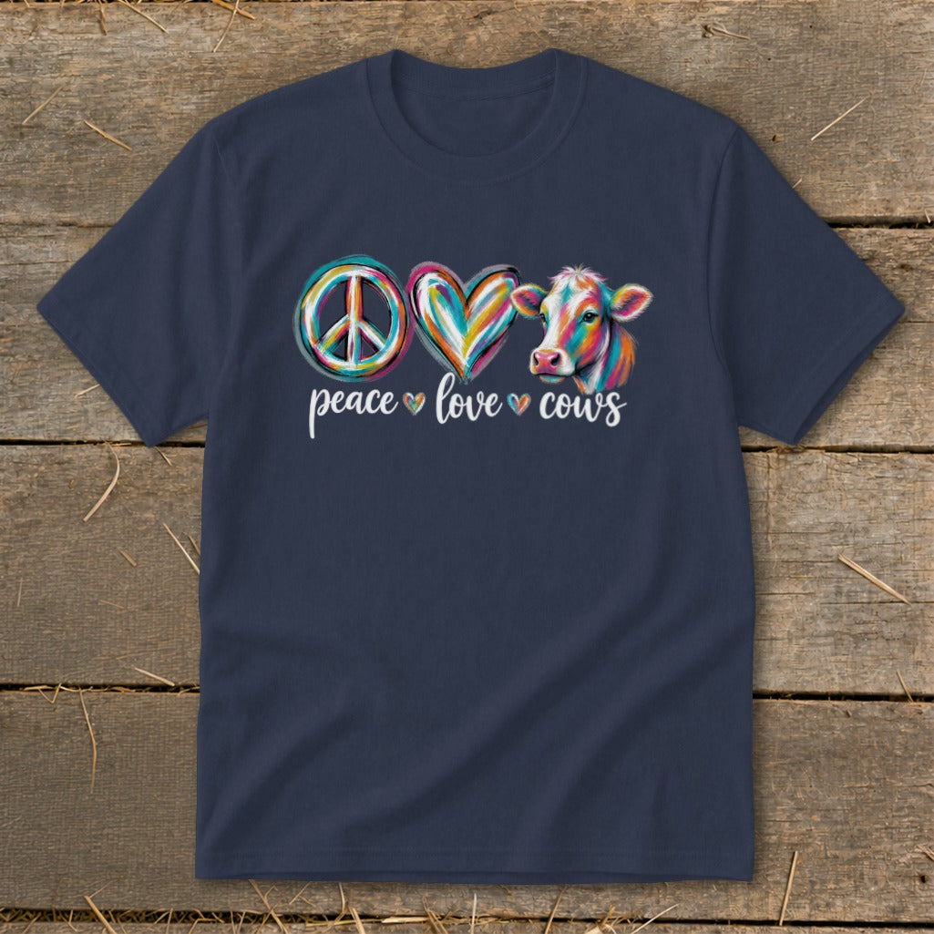 Peace love cows graphic on a navy t-shirt with a colorful cow, heart, and peace sign.