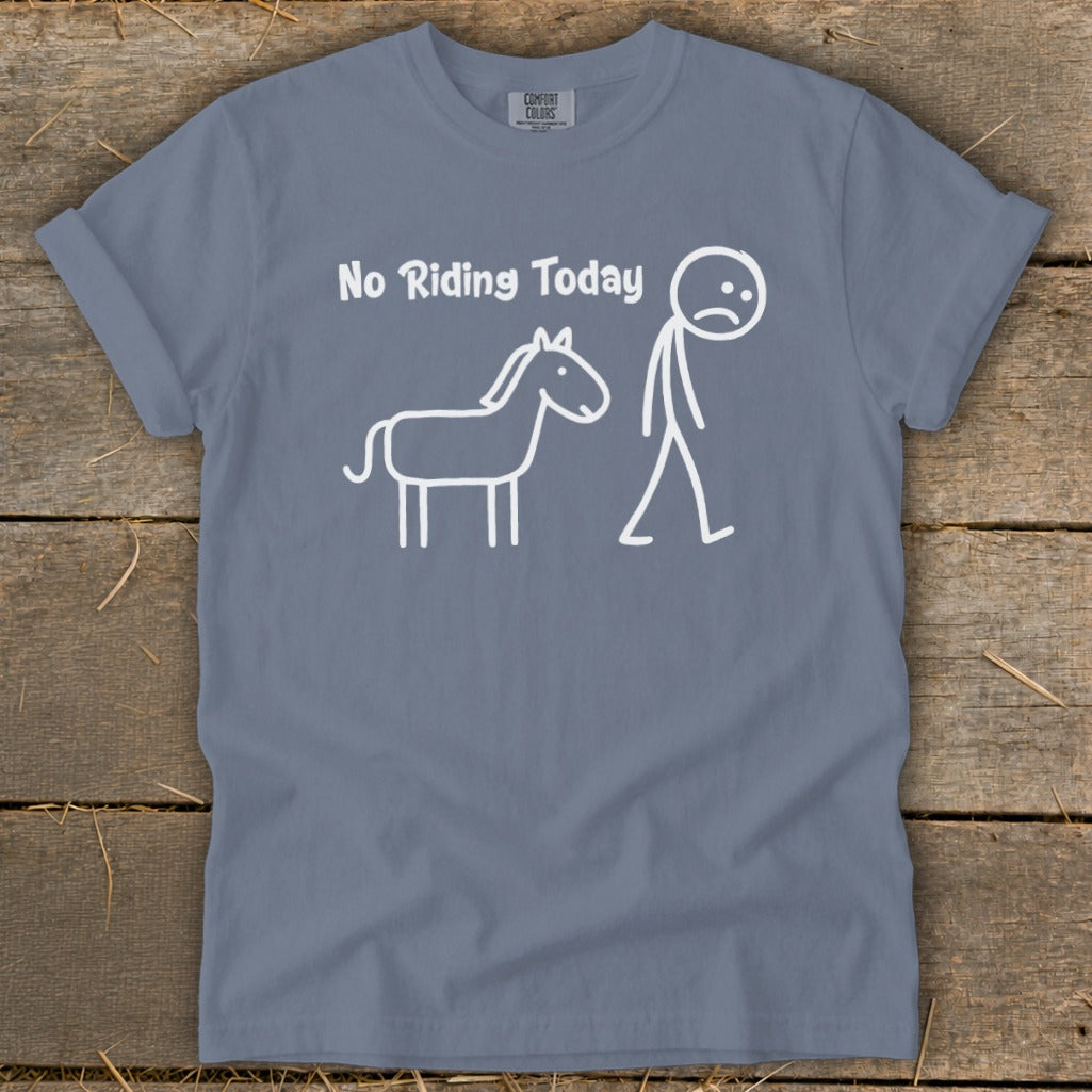 "No Riding Today" text with a sad stick figure next to a horse graphic on a slate blue t-shirt.