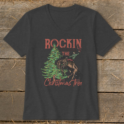 Dark gray v-neck t-shirt with "Rockin' The Christmas Tree" graphic featuring a cowboy on a horse.