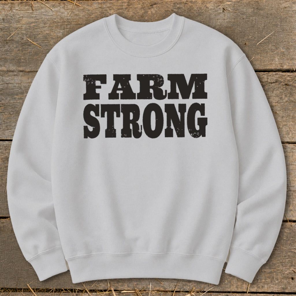Light gray crewneck sweatshirt featuring the black distressed text FARM STRONG centered on the chest.