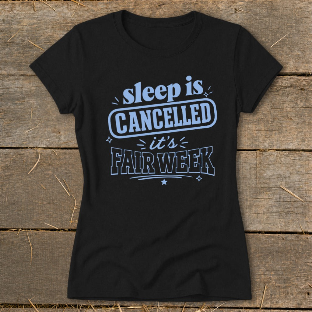 Black t-shirt with "sleep is CANCELLED it's FAIR WEEK" text.