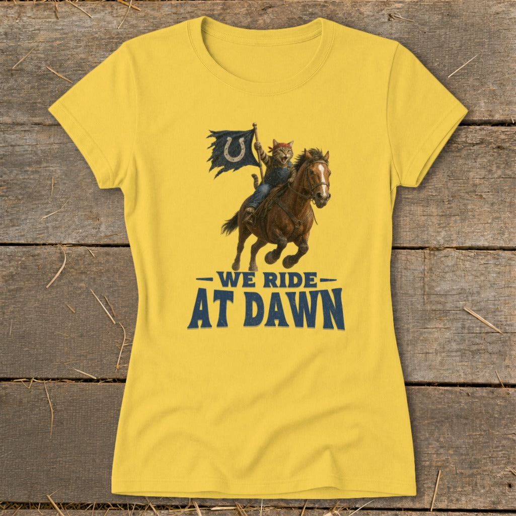 Yellow t-shirt with graphic of cat on horse holding Colts flag, text "We Ride At Dawn".