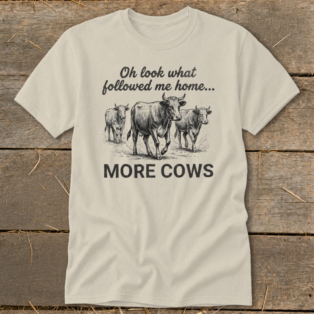 T-shirt with three cows and text "Oh look what followed me home... MORE COWS".