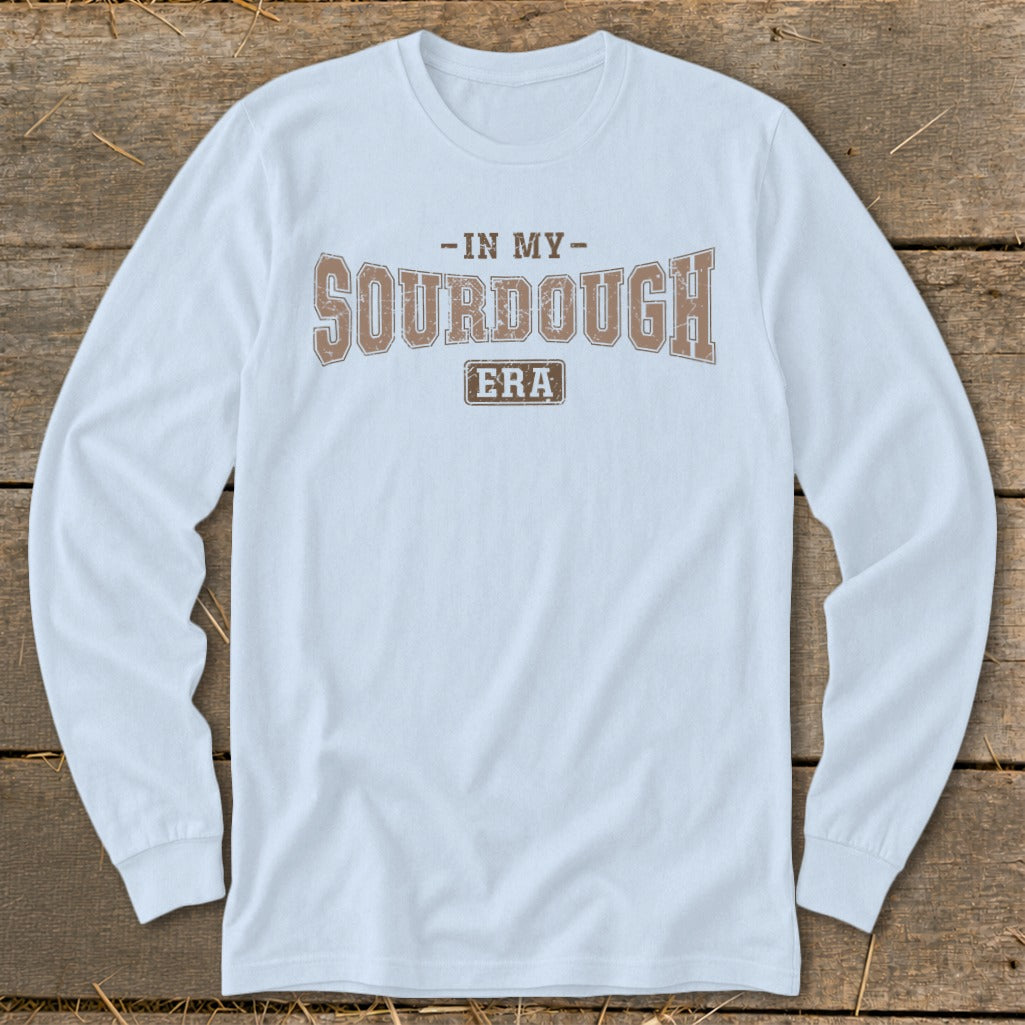 Light blue long-sleeved shirt with "In My Sourdough Era" text graphic.