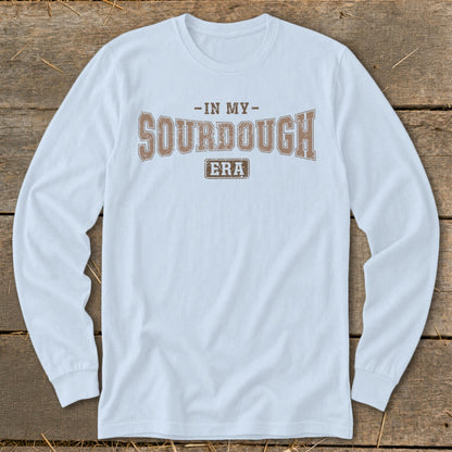 Light blue long-sleeved shirt with "In My Sourdough Era" text graphic.