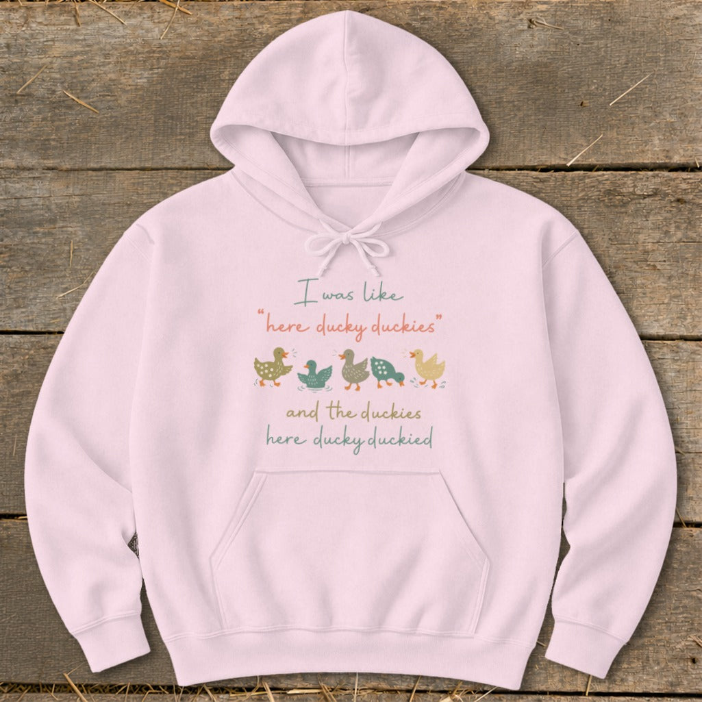 Pink hoodie with text "I was like 'here ducky duckies' and the duckies here ducky duckied" and duck illustrations.