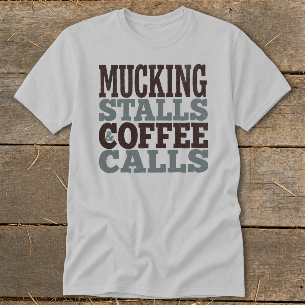 Light gray t-shirt with "Mucking Stalls Coffee Calls" text design.