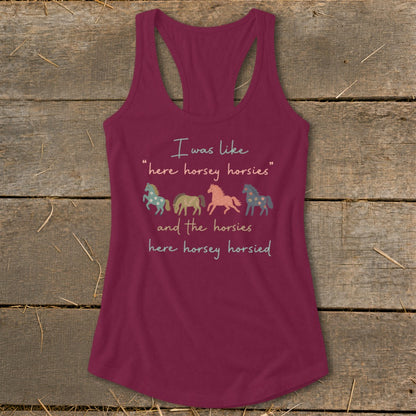 Burgundy tank top with text and four horses: "I was like 'here horsey horsies' and the horsies here horsey horsied".