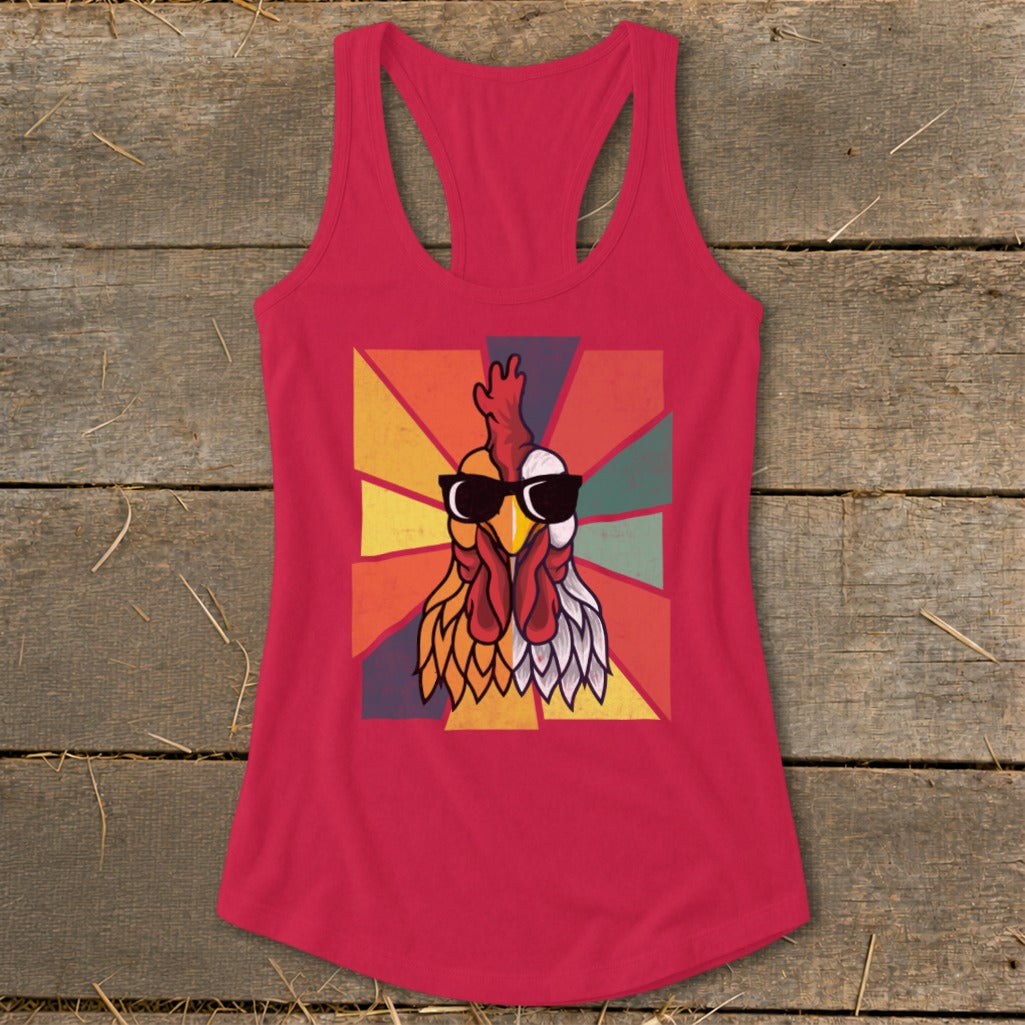 Pink tank top with graphic of a rooster wearing sunglasses on a sunburst background.