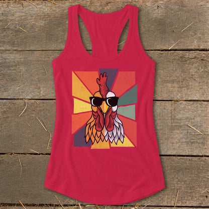 Pink tank top with graphic of a rooster wearing sunglasses on a sunburst background.