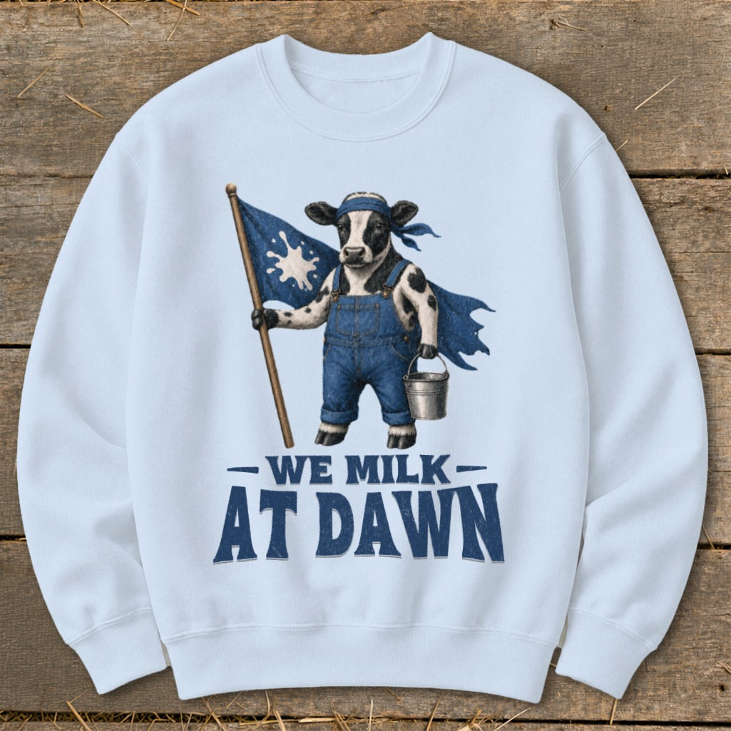 Cow in overalls holding a milk-splattered flag and bucket, text "WE MILK AT DAWN".