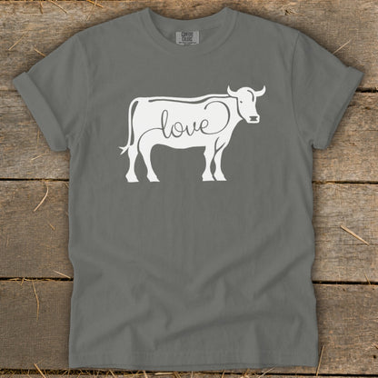 Grey t-shirt with white cow graphic featuring the word "love" inside its outline.