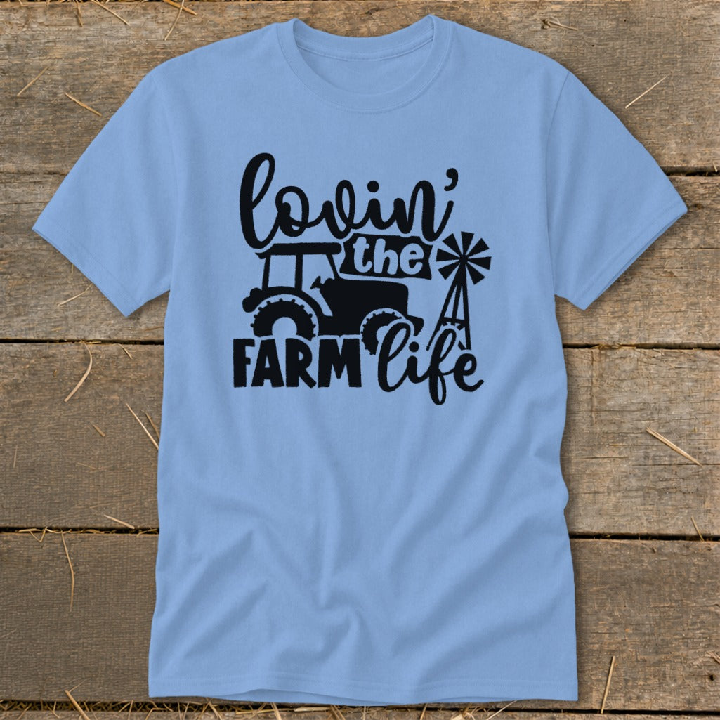 Light blue t-shirt with black graphic: "lovin' the FARM life" and tractor.