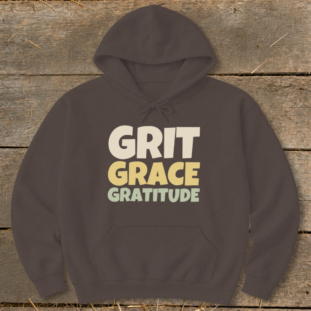 Brown pullover hoodie with text on the front reading GRIT GRACE GRATITUDE.