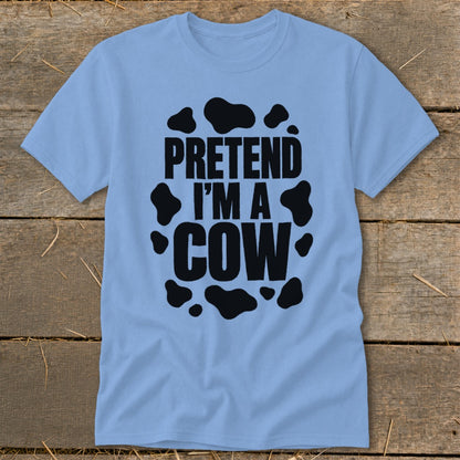 Light blue t-shirt with black text "PRETEND I'M A COW" and cow spots.