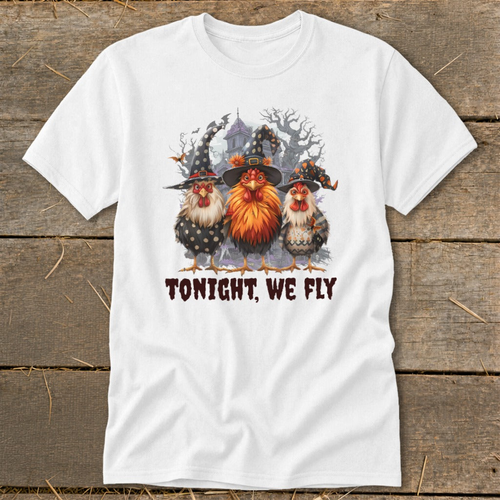 Three chickens in witch hats with a spooky haunted house and trees, text "TONIGHT, WE FLY".