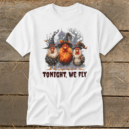Three chickens in witch hats with a spooky haunted house and trees, text "TONIGHT, WE FLY".