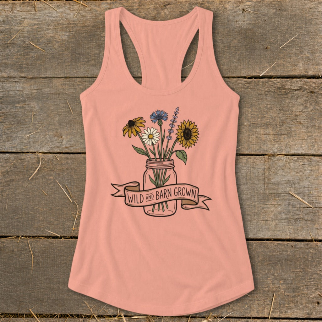 Peach tank top with a mason jar bouquet and banner that reads "Wild and Barn Grown".