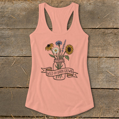 Peach tank top with a mason jar bouquet and banner that reads "Wild and Barn Grown".