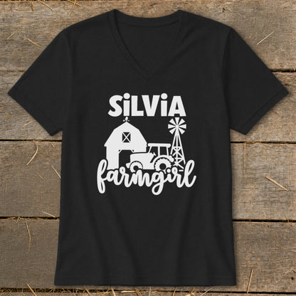 Black v-neck shirt with "Silvia farmgirl" text and farm graphics.