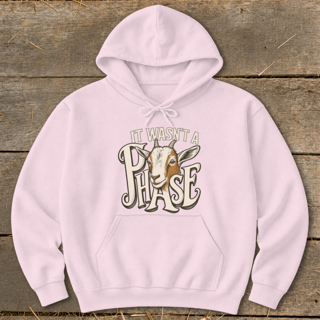 Pink hoodie with a goat and "It wasn't a phase" text graphic.